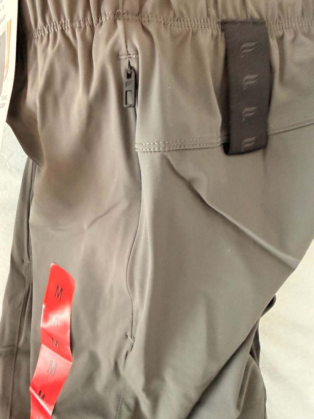 Fabletics Men's Active Short with Towel Loop, Zip Pockets, and 7-inch Inseam - Picture 3 of 3